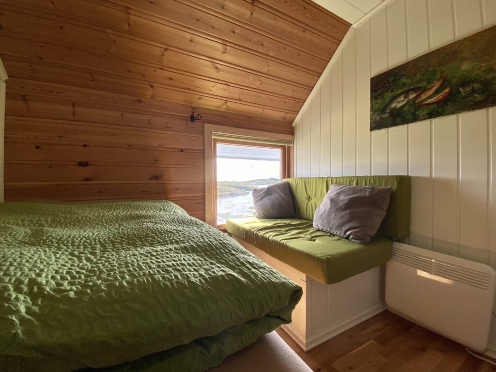 The smallest room in The White House with a gorgeous view of Norwegian seascape and the private pier of Tjongsfjord Lodge
